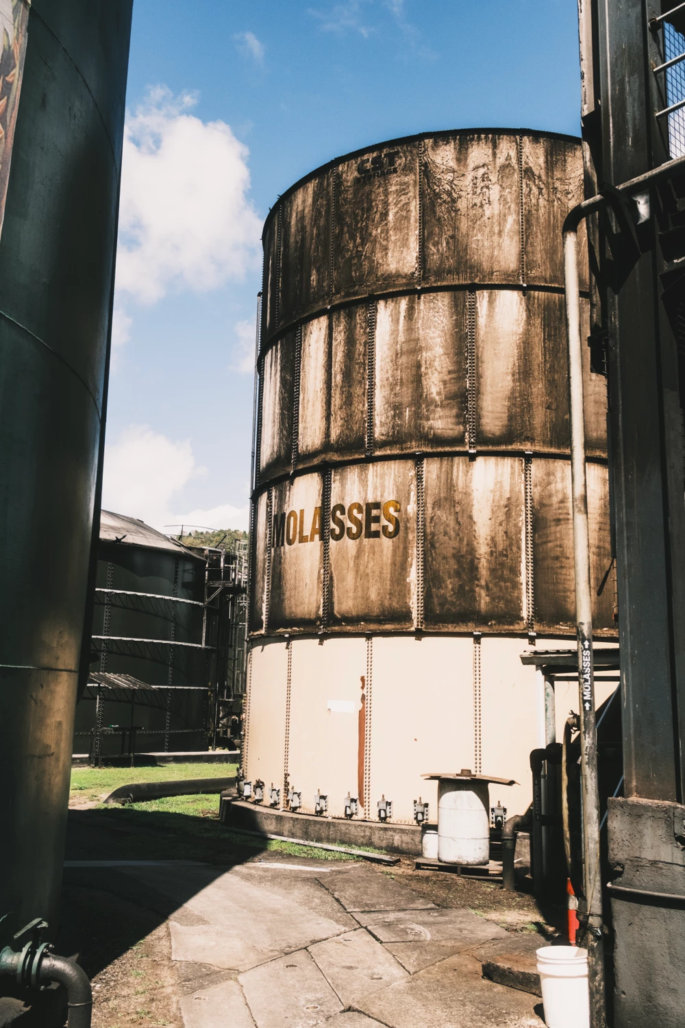 Industrial molasses storage tank at a rum distillery