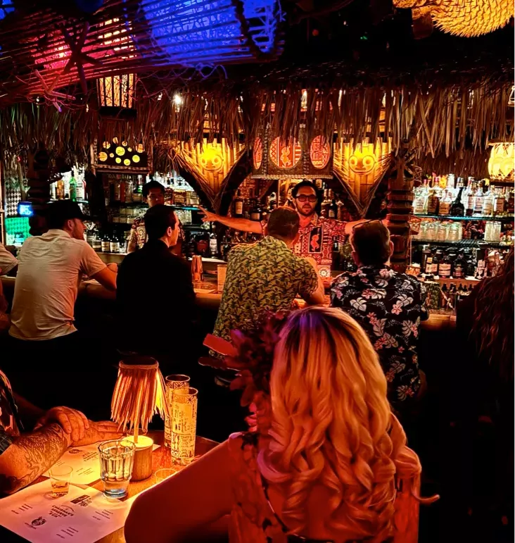 Bryan in a Tiki Bar as a rum tasting host